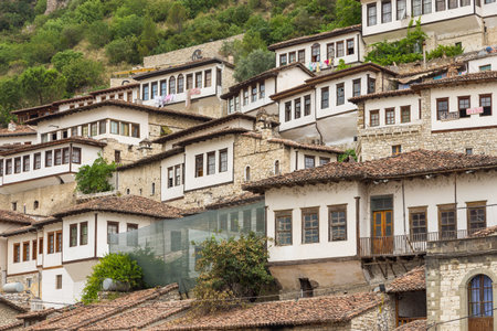 Berat, Albania- 30 June 2014: View of the historical district of Managlem. Ottoman architecture,...