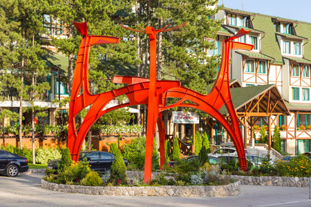 Zlatibor, Serbia- 14 August 2014: The main street of the city of Zlatibor. Red, modern monument in the center. Zlatibor, a mountain resort in Serbia.のeditorial素材