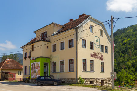 Mokra Gora, Serbia- 15 August 2014: Large yellow building on the main street of Mokra Gora., village in the Tara mountains.のeditorial素材