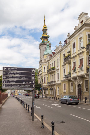 Belgrade, Serbia- 17 August 2014: Street of the city of Belgrade. Building and church with high tower. Cars on the street.のeditorial素材