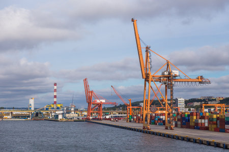 Poland, Gdynia- 01 September 2014: Container terminal in Gdynia. View of harbor cranes and containers.のeditorial素材