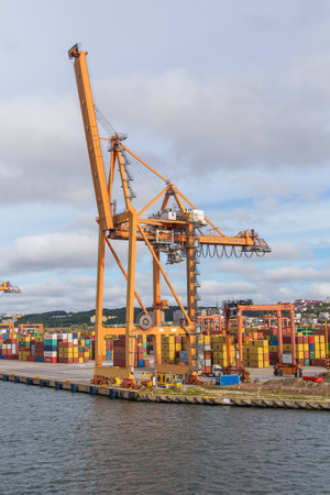 Poland, Gdynia- 01 September 2014: Container terminal in Gdynia. View of harbor cranes and containers.のeditorial素材