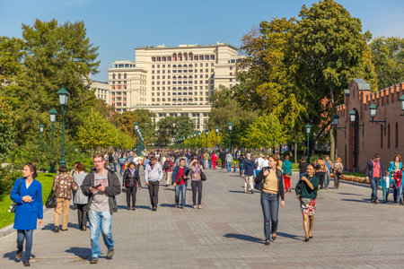 Moscow, Russia- 20 September 2014: Walking path in Alexander Garden, public urban park. Facades of historic tenements and walking people.のeditorial素材