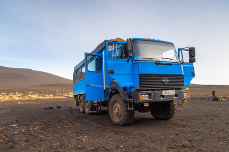 Kamchatka Peninsula, Russia- 28 September 2014: Russian off-road extreme expedition truck with passengers. Black, volcanic sands.のeditorial素材