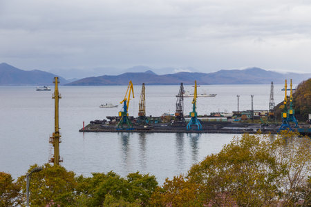 Petropavlovsk-Kamchatsky, Russia- 05 October 2014: View of harbor cranes. Shipyard ans sea port on the Avacha Bay, Pacific Ocean. Industrial area.のeditorial素材