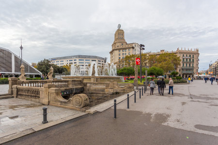 Barcelona, Spain- 09 November 2014: View of the Catalonia Square, large square in central Barcelona. Building facades, decorative entrance to the underpass.のeditorial素材