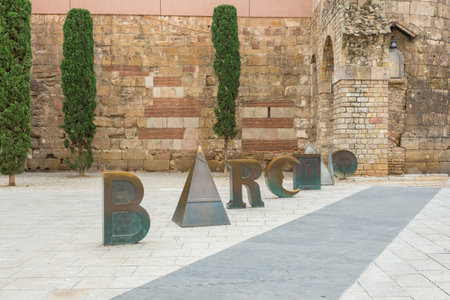 Barcelona, Spain- 09 November 2014: Inscription from the golden letters of Barcino on Nova Square, a Roman settlement currently archaeological digs.のeditorial素材