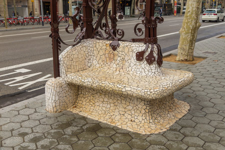 Barcelona, Spain- 10 November 2014: Bench made of stones with cast iron decorations at Passeig de Gracia, Eixample District. New part of the city.のeditorial素材
