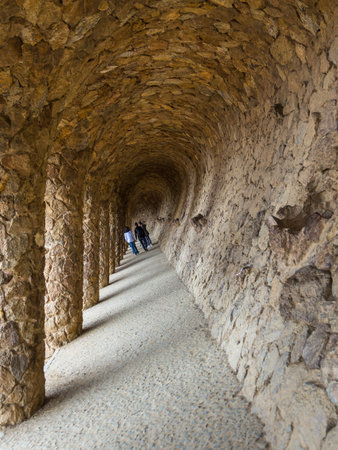 Barcelona, Spain- 10 November 2014: Colonnaded pathway, part of the Park Guell by architect Antonio Gaudi. The main attraction of Barcelona.のeditorial素材