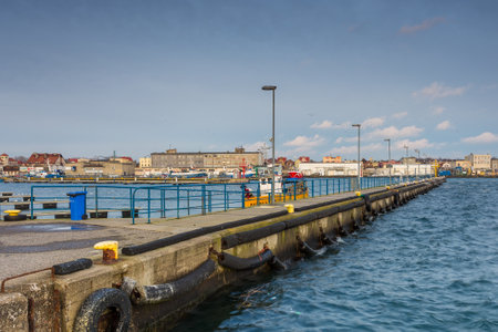 Hel, Poland- 31 January 2015: View of the breakwater and seaport in the city of Hel. Town and Baltic Sea in the background.のeditorial素材