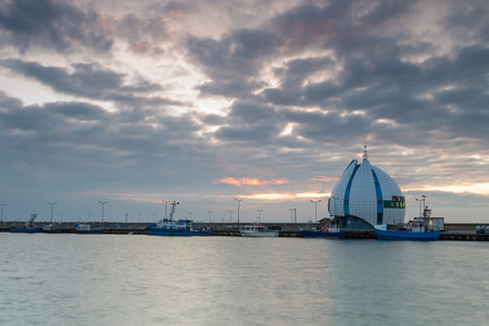 Hel, Poland- 31 January 2015: View of the seaport and breakwater. Boats and cutters moored in the port. Small town located on the Hel Peninsula.のeditorial素材