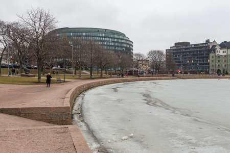 Helsinki, Finland- 28 February 2015: View of the modern buildings at Porthaninrinme street, center of the town. Building S-Market Ympyratalo in the shape of a rotunda.のeditorial素材