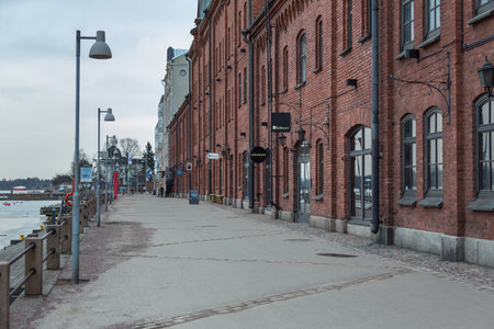 Helsinki, Finland- 28 February 2015: View of old red brick buildings on the waterfront. Granite island of Katajanokan in the city center.のeditorial素材