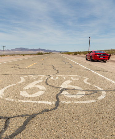 Red Ford Mustang on the Route 66, Ludlow, USA.のeditorial素材