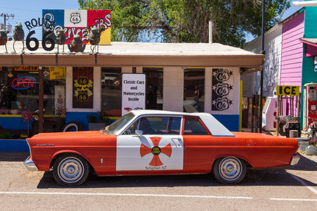 Seligman, Arizona, USA- 01 June 2015: Old, antique car parked on the legendary Route 66. Souvenir...