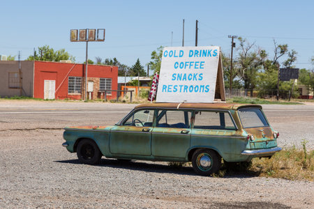 Truxton, Arizona, USA- 01 June 2015: Red building and old car with advertising cafe. National Trails Highway, Route 66.のeditorial素材