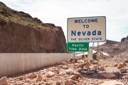 Boulder City, Nevada, USA- 01 June 2015: Large sign informing about the Nevada state border and the Pacific Time Zone. Near Hoover Dam.のeditorial素材