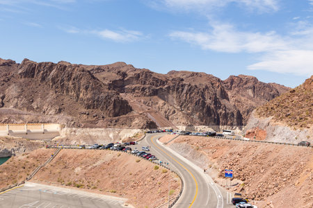 Boulder City, Nevada, USA- 01 June 2015: View of the Hoover Dam, a concrete gravitational arc dam, built in the Black Canyon on the Colorado River. Road and car park.のeditorial素材