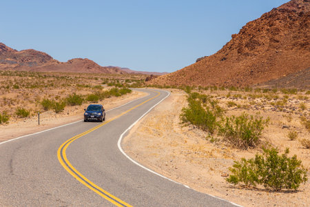 Death Valley, California, USA- 02 June 2015: Car on the Jubilee Pass Road to Death Valley National Park. The natural beauty of the Desert Hills.California, USA.のeditorial素材