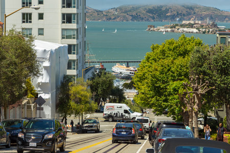 San Francisco, California, USA- 07 June 2015: Elegant facade townhouse and parked cars on the famous...