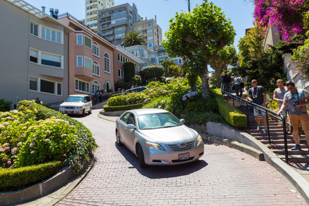 San Francisco, California, USA- 07 June 2015: Cars on the famous, winding Lombard Street. The crookedest street in the world.のeditorial素材