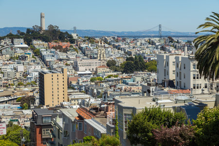 San Francisco, California, USA- 07 June 2015: View of the Downtown, Coit Tower and Oakland Bay bridge from Lombard Street.のeditorial素材