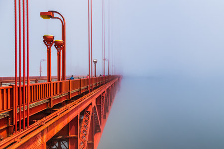 San Francisco, California, USA- 08 June 2015: The Golden Gate Bridge the morning fog. Art Deco elements.のeditorial素材