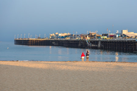 Santa Cruz, California, USA- 08 June 2015: View of the wooden pier, Municipal Wharf. People on the beach.のeditorial素材