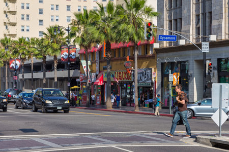 Los Angeles, Hollywood, USA- 10 June 2015: Modern building and cars at Hollywood Boulevard. Film district of the city.のeditorial素材
