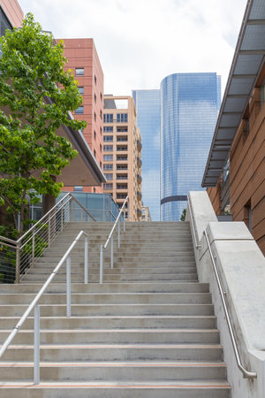 Los Angeles, California, USA- 11 June 2015: Tall, modern buildings of Downtown in Los Angeles. Stairs in the foreground.のeditorial素材