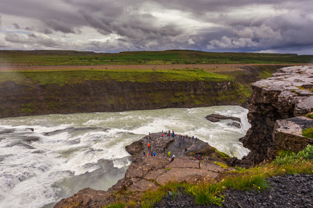 Gullfoss, Iceland- 22 August 2015: Panoramic view of Gullfoss waterfall on the HvÃ­tÃ¡ river, a popular tourist attraction, part of the Golden Circle Tourist Route in Southwest Iceland. Golden Waterfallのeditorial素材