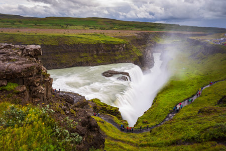 Gullfoss, Iceland- 22 August 2015: Panoramic view of Gullfoss waterfall on the HvÃ­tÃ¡ river, a popular tourist attraction, part of the Golden Circle Tourist Route in Southwest Iceland. Golden Waterfallのeditorial素材