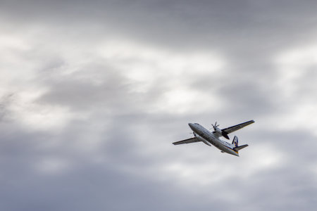 Reykjavik, Iceland- 27 August 2015: A small, turboprop plane from the Flugfelag Islands in the skies...
