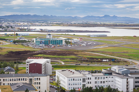 Reykjavik, Iceland- 27 August 2015: Panoramic view of the city of Reykjavik from Hallgrimskirkja tower. Mountain in the background.のeditorial素材