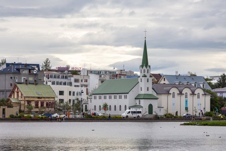 Reykjavik, Iceland- 27 August 2015: Beautiful landscape of the cityscape of Reykjavik in lake Tjornin.のeditorial素材