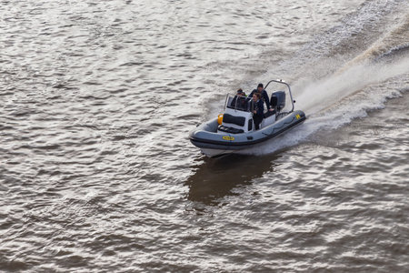 London, United Kingdom, UK- 03 October 2015: People cruising the Thames by motorboat, Battersea...