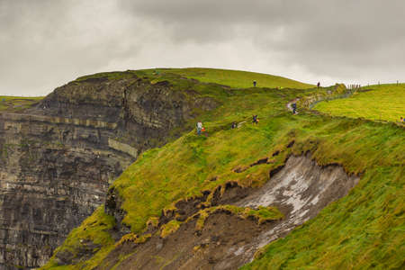 Aerial panorama of the scenic Cliffs of Moher in Ireland. This popular tourist attraction is...