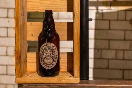 Dublin, Ireland - 09 November 2015: Interior of Guinness store in Dublin. Large beer bottle. Guinness Storehouse is a tourist attraction at St. James Gate Brewery.のeditorial素材