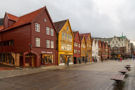 Bergen, Norway - 12 December 2015: View of the Bryggen series of Hanseatic heritage commercial buildings lining up the eastern side of Vagen harbor.のeditorial素材