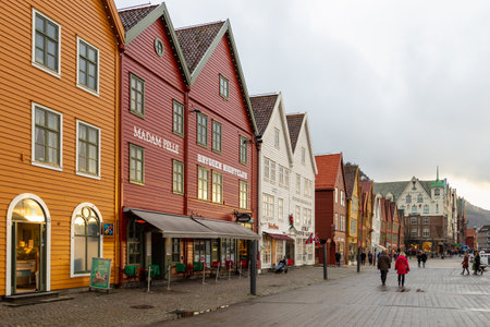 Bergen, Norway - 12 December 2015: View of the Bryggen series of Hanseatic heritage commercial buildings lining up the eastern side of Vagen harbor.のeditorial素材