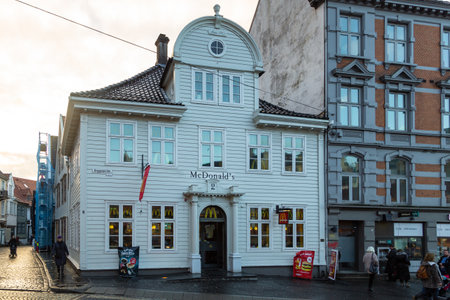 Bergen, Norway - December 12, 2015: McDonald restaurant in old wooden traditional nordic house in old city. Bryggesporden street.のeditorial素材