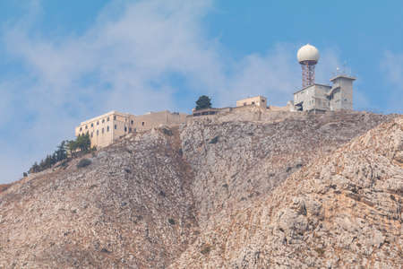Mesa Vouno Mountain, weather station at the top. Greece, the island of Santorini on southern Aegean Sea.の写真素材