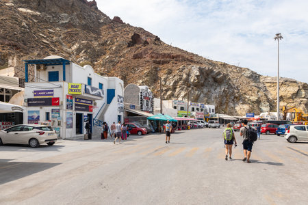 Ormou Athiniou, Santorini Island, Greece: Harbor Thira of Santorini at the foot of a high cliff, People waiting for the ferry.のeditorial素材
