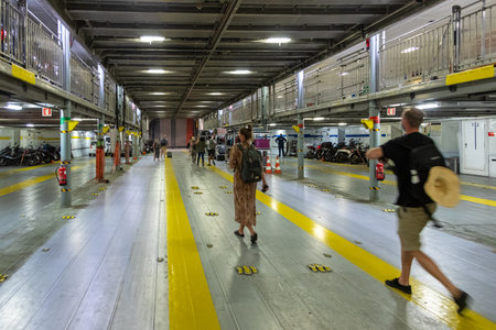 Ormou Athiniou, Santorini Island, Greece- 19 2020: People on a Seajets Ferry crossing Cyclades Islands. The Seajets Ferry is a passenger ferry service operator and tourist attraction in Greece.のeditorial素材