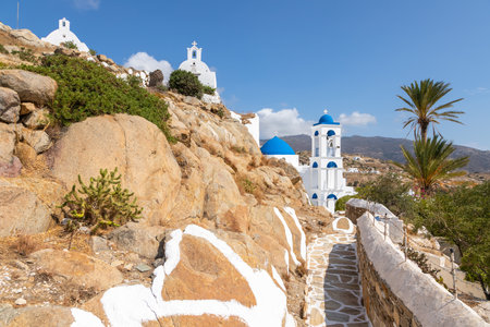 Chora, Ios Island, Greece- 20 September 2020: View of the Church of Virgin Mary of the Cliff. White building on the hill. Beautiful, sunny day.のeditorial素材