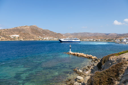 Chora, Ios Island, Greece- 22 September 2020: View of the Harbor of Ios. Passenger ferry departing...