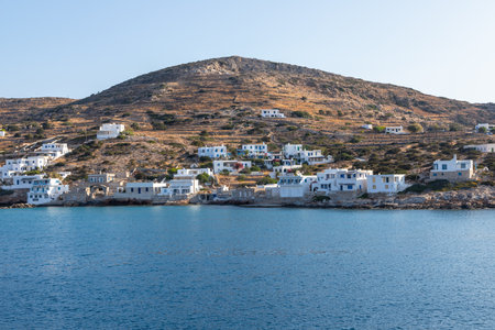 Sikonos, Greece- 23 September 2020: View of the harbor of Sikinos Island. People waiting for the ferry. Traditional white building on the hills.のeditorial素材