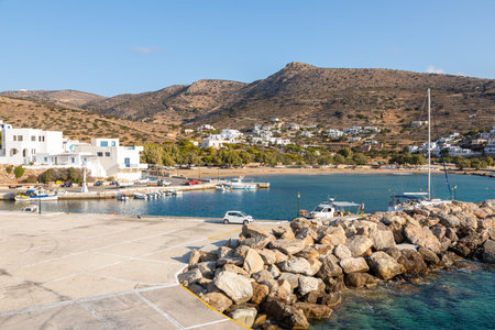 Sikonos, Greece- 23 September 2020: View of the harbor of Sikinos Island. People waiting for the ferry. Traditional white building on the hills.のeditorial素材