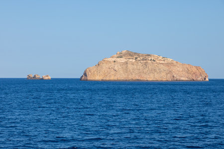 Rock island on Aegean Sea.Cyclades Archipelago, Greece.の写真素材