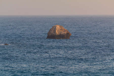 View of the coast and Agkali beach of the island of Folegandros at sunset. Aegean Sea, Cyclades Archipelago, Greece.の写真素材